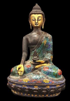 statue of a seated buddha on a black background with a black background