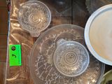a table with a lot of dishes and cups on it