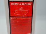 a bottle of creme a recuerr sitting on a table
