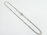 a long silver chain with a clasp on a white background