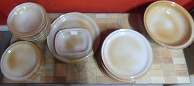 a lot of plates and bowls on the table