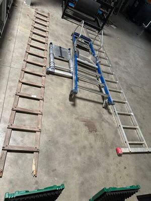 several pieces of equipment are laid out on the floor in a garage
