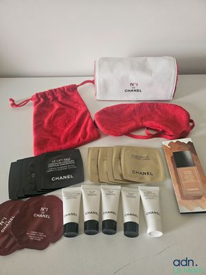 a bag of cosmetics and a pouch of eyeliners on a table