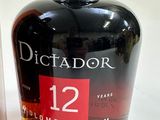 bottles of dictador 12 year old rum and a glass of rum