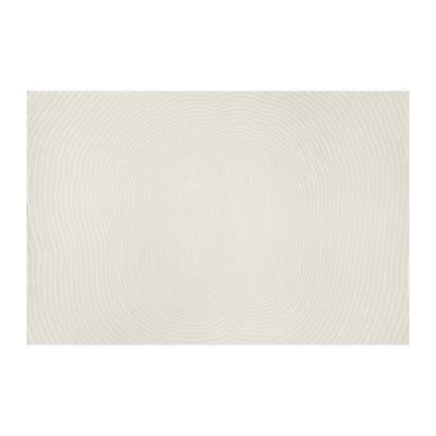un tapis blanc orné d'un motif en spirale