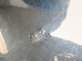 a close up of a stuffed animal with a tag on it
