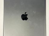 an apple ipad sitting on top of a white table next to a white wall