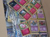 a box full of pokemon cards sitting on top of a table