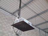 a light that is hanging from the ceiling of a building