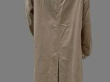 an image of a mannequin wearing a beige coat and white shoes
