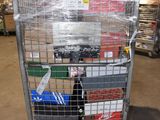 a metal cart with many items in it in a warehouse