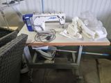 a sewing machine sitting on top of a table in a room