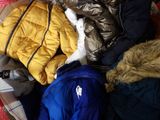 a pile of clothes that is sitting on the floor