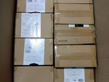 several boxes of electronic devices are stacked in a cardboard box