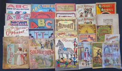 many old children ' s books on display on a table