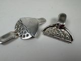 two pieces of metal that are sitting on a table
