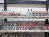 a lot of makeup products on the shelves in the store