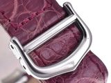 a close up of a purple watch with a metal buckle