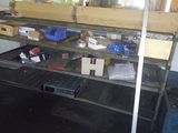 a metal shelf with boxes on it in a room