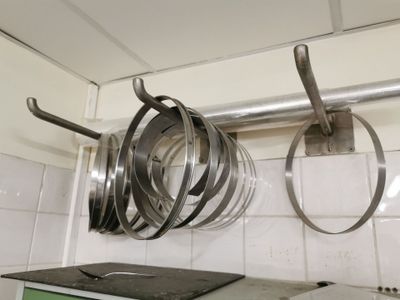 pots and pans hanging from the ceiling in a kitchen