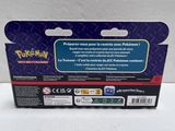 a close up of a box of pokemon trading cards on a white surface