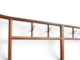 an image of a wooden shelf with hooks on it