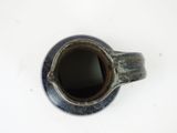 a close up of a cup of coffee on a table