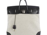 a black and white bag with a zipper on it