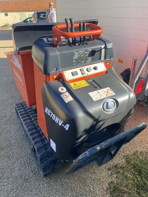 an image of a machine that is parked in the driveway