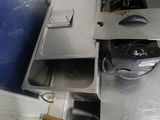 an image of a kitchen with a sink and a toaster oven