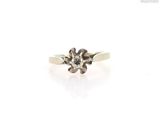 a close up of a diamond ring on a white background