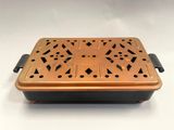an old copper plate with holes and holes on it