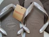 a pair of flip flops that are on a table