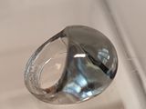 a clear glass ring sitting on top of a table