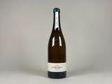 a bottle of wine that is sitting on a table