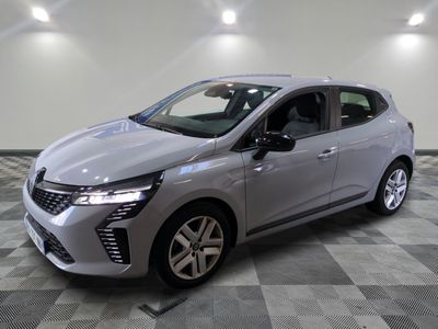 a silver car parked in a room with a checkered floor