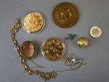 a lot of gold and silver jewelry on a table