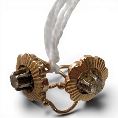 gold plated cuff earrings with a white cord and a white cord