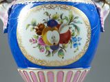 a large blue vase with a floral design on it