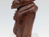 an image of a sculpture of a man with a hat on his head