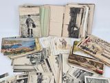 a pile of old postcards with pictures of people on them