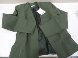a green jacket sitting on top of a white table