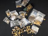 a lot of gold coins and a bag of gold coins