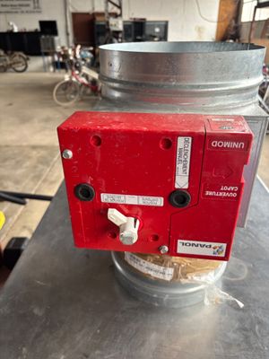 a red machine that is sitting on a table