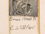 a picture of a plaque with a clock on it
