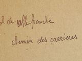 handwriting on a piece of brown paper with writing on it