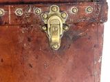 an old wooden trunk with a latch on it