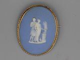 an oval blue and white picture of a man and a woman