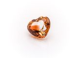 an orange topazte gems on a white background