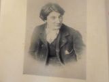 a black and white photo of a woman in a suit